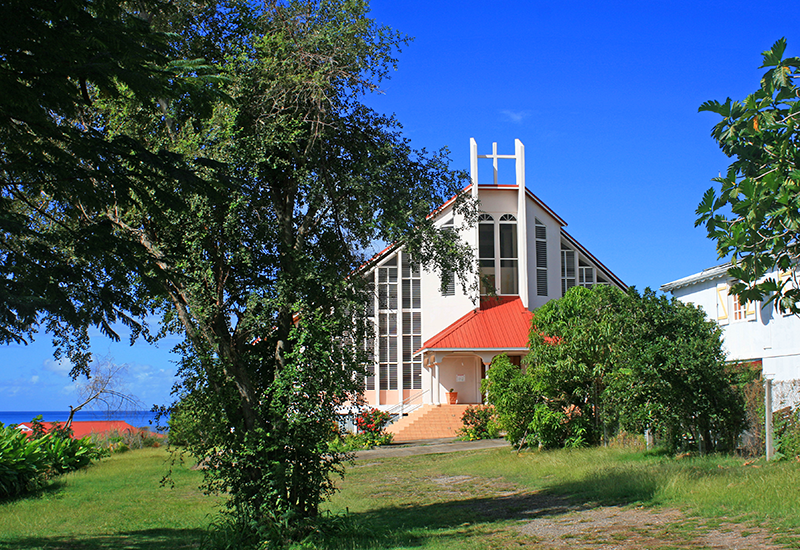 Vieux-Habitants, Adventist Church. Overlooking the sea, in a park